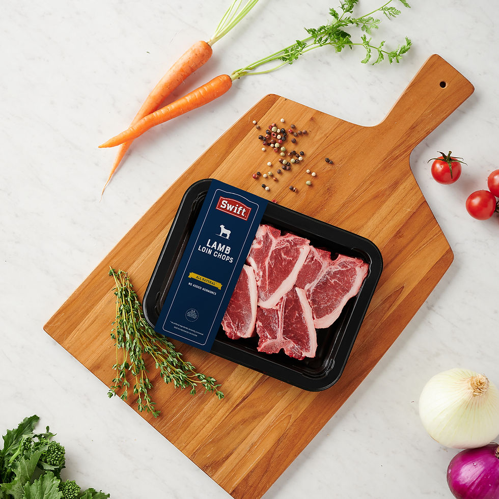 Swift Lamb Chops on a cutting board surrounded by vegetables